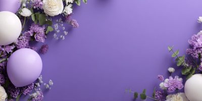 Vibrant purple flowers and white decorative spheres are arranged beautifully against a bright purple background, creating a cheerful and fresh atmosphere for spring events..